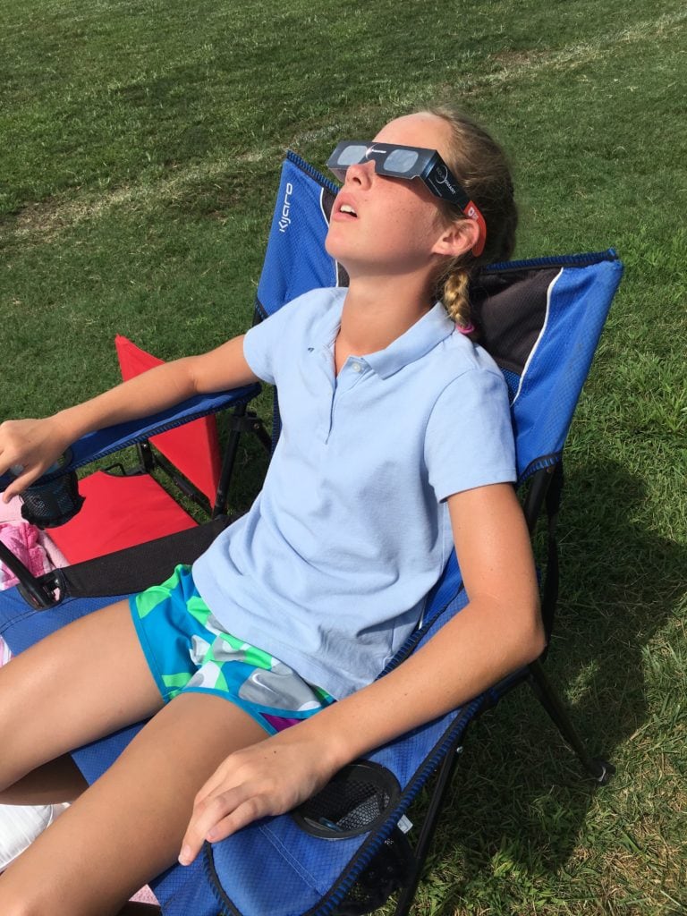 Experiencing the Solar Eclipse Path of Totality - Delaney watched as the sun disappeared behind the moon - saying it looked like the Cheshire Cat from Alice in Wonderland